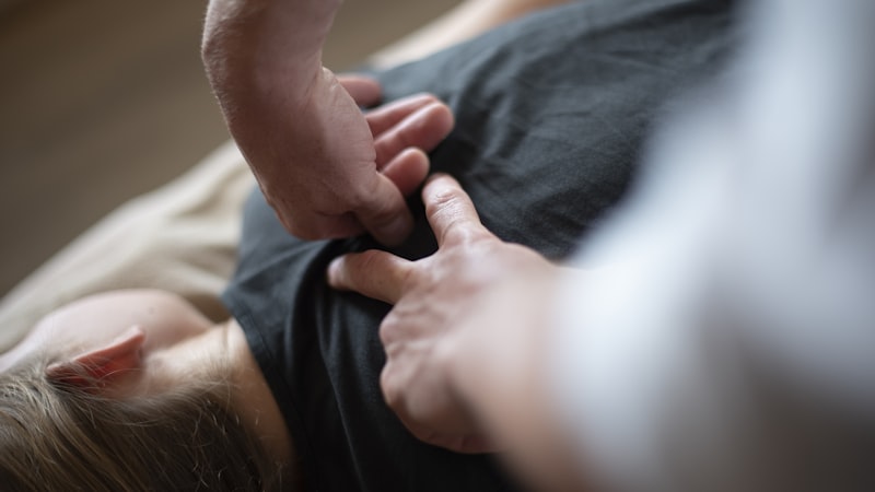 A chiropractor performing a spinal adjustment